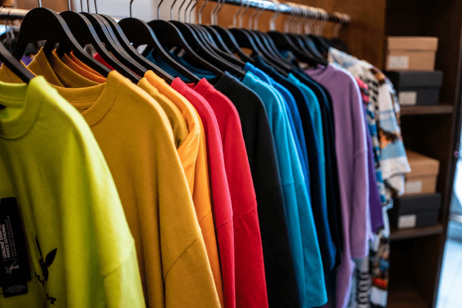 colorful shirts with stacked shoeboxes